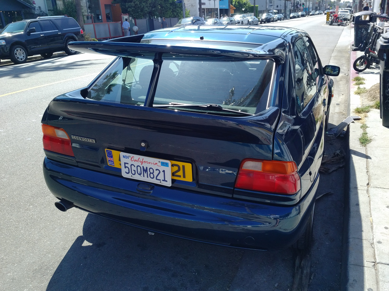 Illustration for article titled Who put a Merkur wing on an old BMW 3 series?!